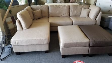 Brand new 104"x 75" biege linen reversible sectional + ottoman