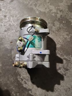 1982...1983  NISSAN central AC COMPRESSOR  NEW NEVER USED $ 100 
