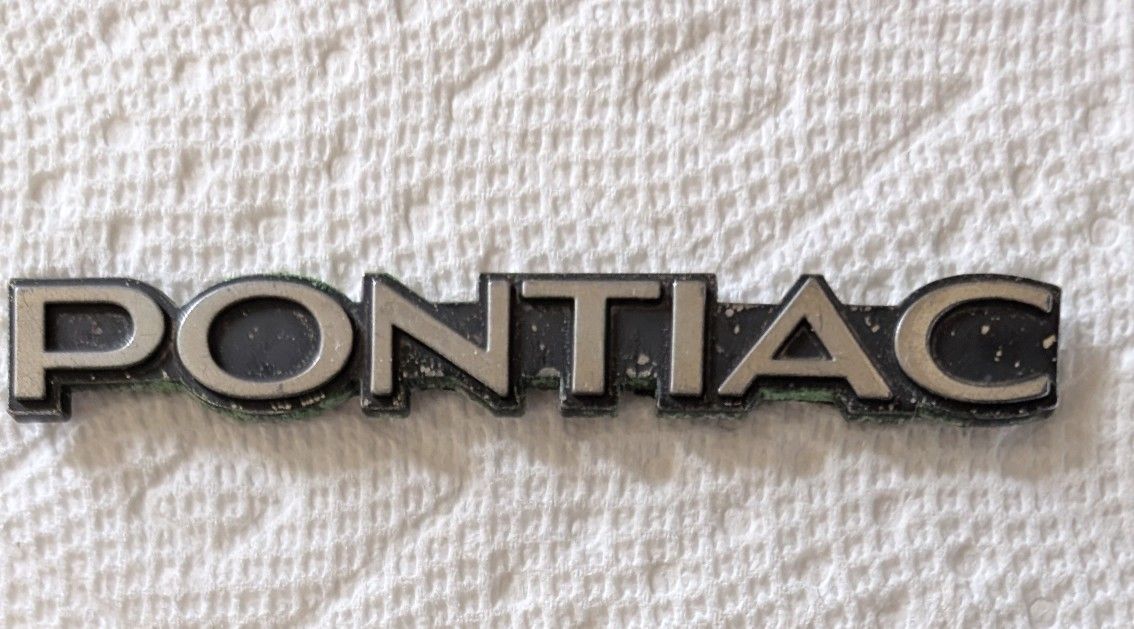 Original GM Pontiac 70's 80's Firebird GrandAm Trunk Emblem Name Plate Badge.