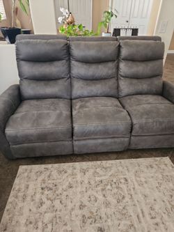 Headline: Gray Fabric Recliner Loveseat / Console & Cup Holders
