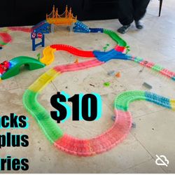 $10 Magic Track set of 400 + pieces, car and accessories batteries including