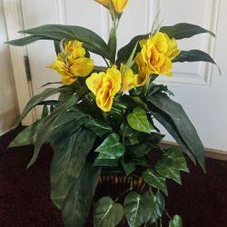 Artificial  flowers in a decorative container