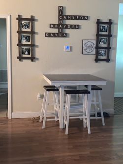 Table with 3 stools