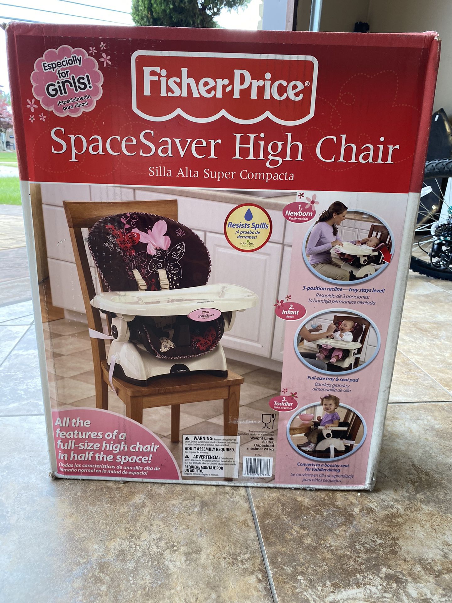 Still brand new in the box Fisher price SpaceSaver High Chair