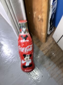 Numerous Filled Coca Cola Bottles