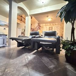 Beautiful Set Of Two Matching Power Leather Rocker Recliner Chairs With Power Headrest