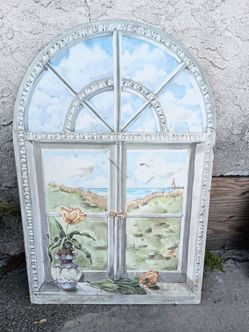 hand-painted wooden wall panel featuring a trompe l'oeil coastal window