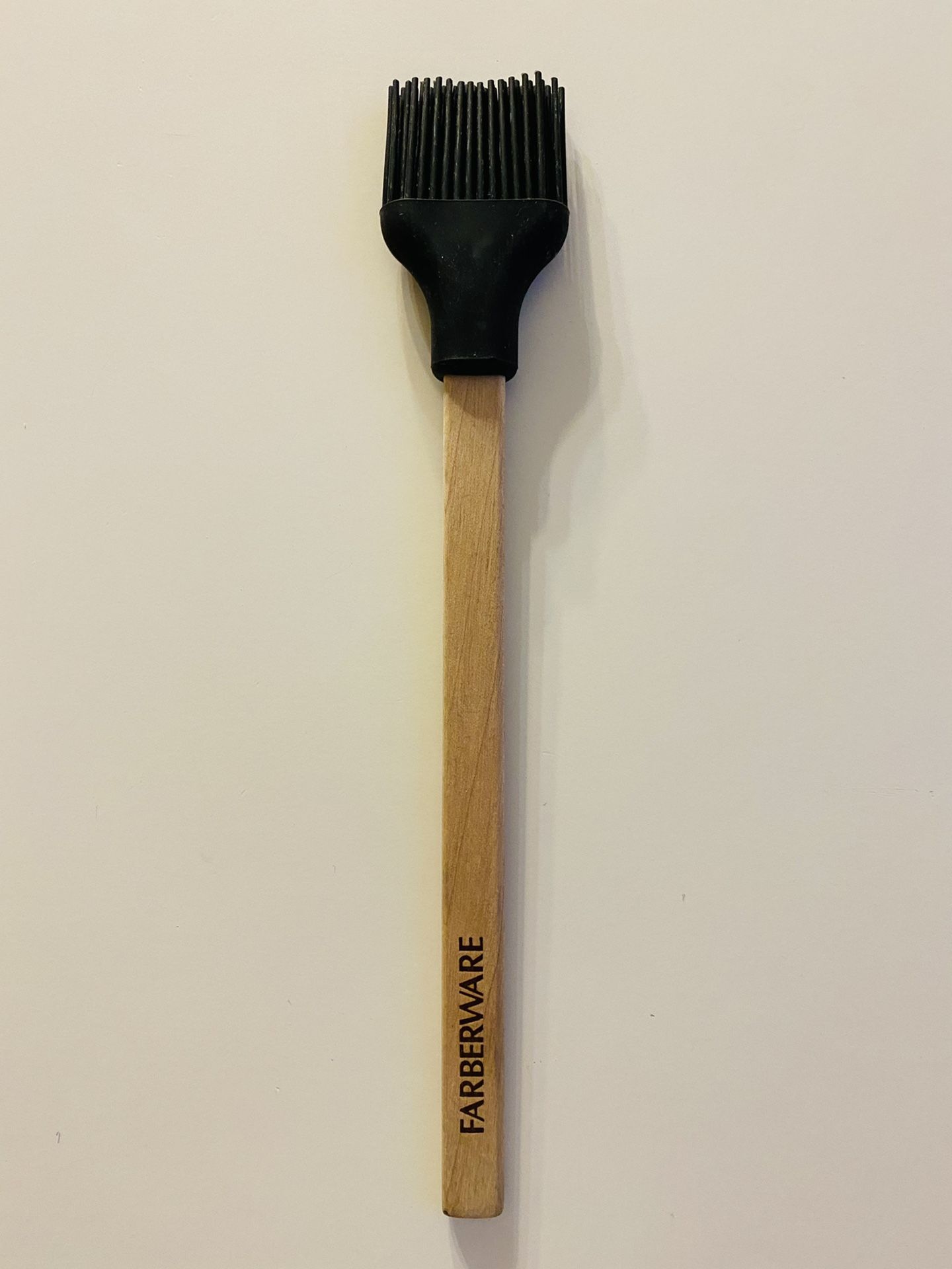 Basting Brush. Farberware. Silicone Bristles are Heat Resistant. Bristles don’t shed. High quality Wooden Handle. New. Never used. 12” long.