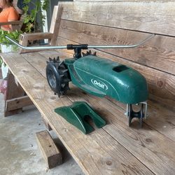 Orbit Cast Iron, Hose Track Sprinkler With Hose Guide