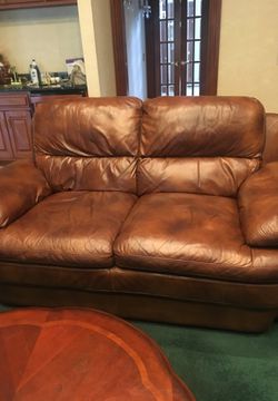 pure leather sofa with coffe table heavy one seat has some marks only$2000 table pure wood 6 draws like new $400 sofa 6 seater with otoman