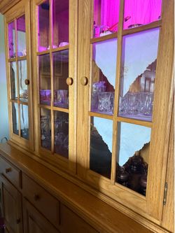 An antique-style stand for light brown glass.