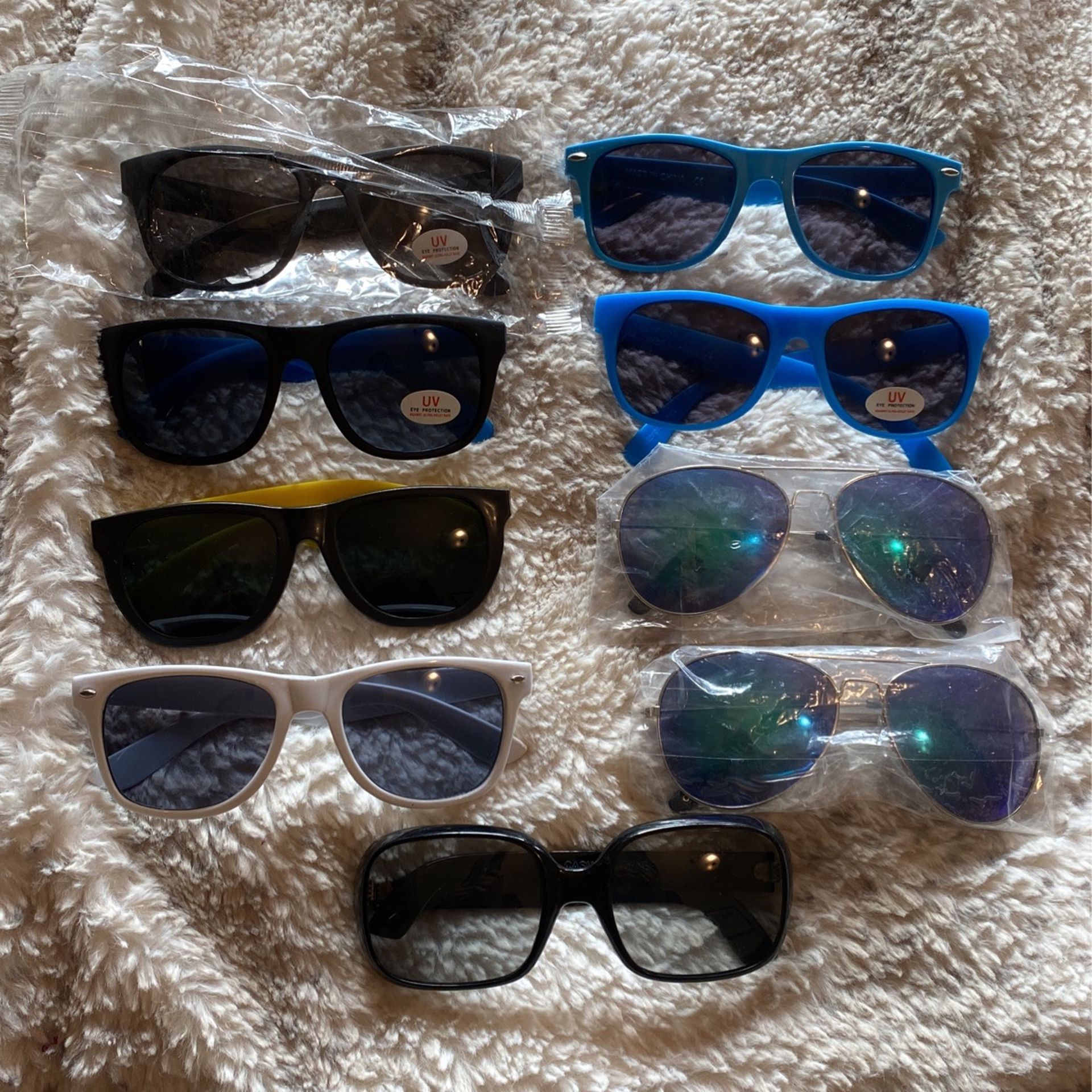 9 pairs of assorted sunglasses