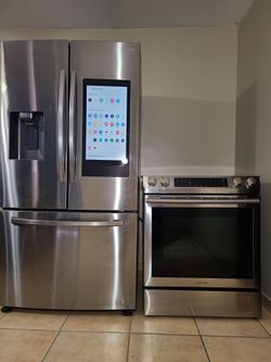Samsung Stainless Steel Refrigerator and electric Range Set...