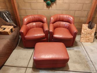 Single seat Hancock & Moore rocking chair couches with separate foot rest