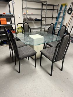 Glass Dinning Table With 6 Matching Chairs