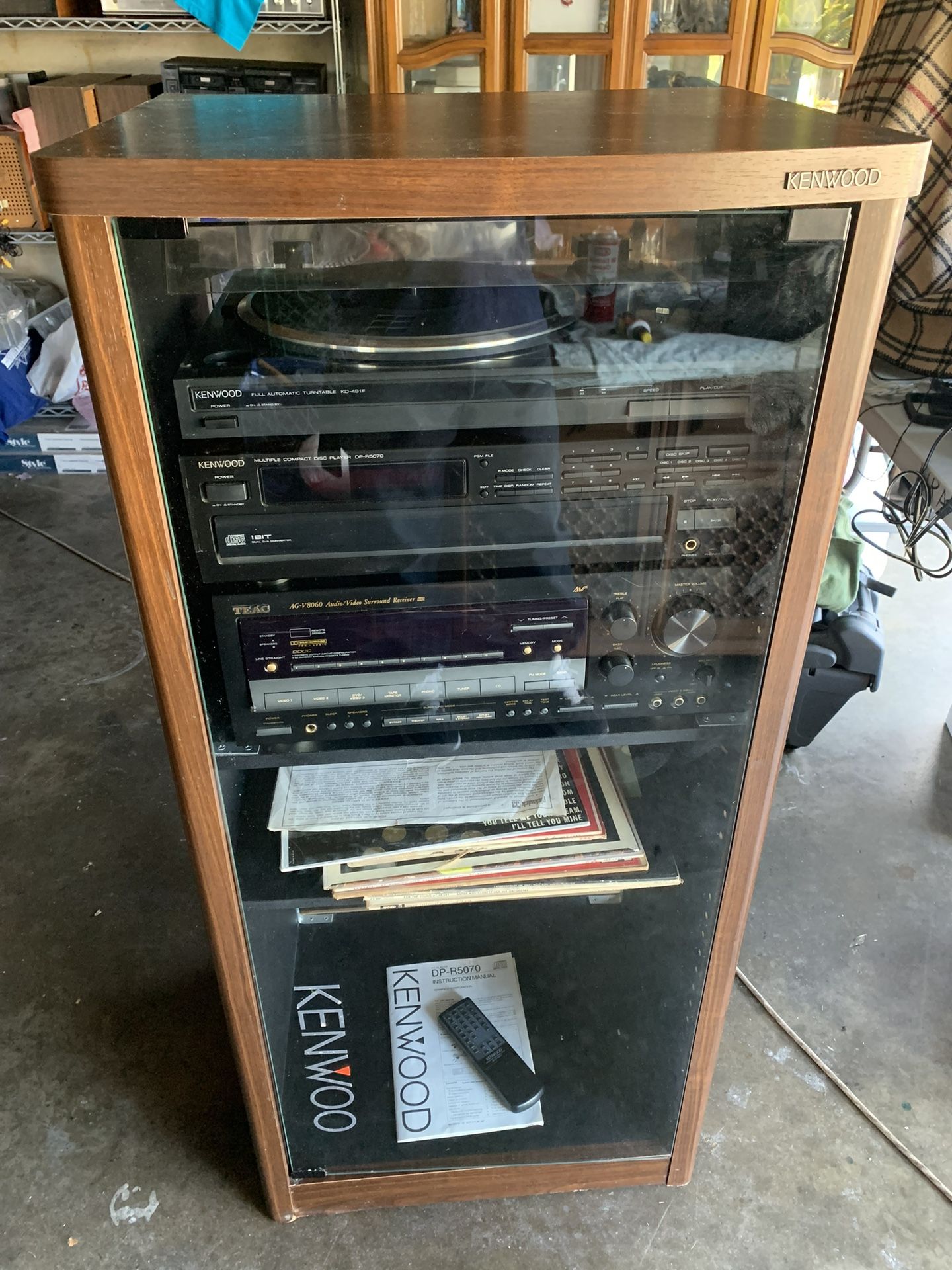 Stereo system Teac receiver, Kenwood disc player,Kenwood turntable,Kenwood rack with glass door, vinyl records included..Clean and everything works $1