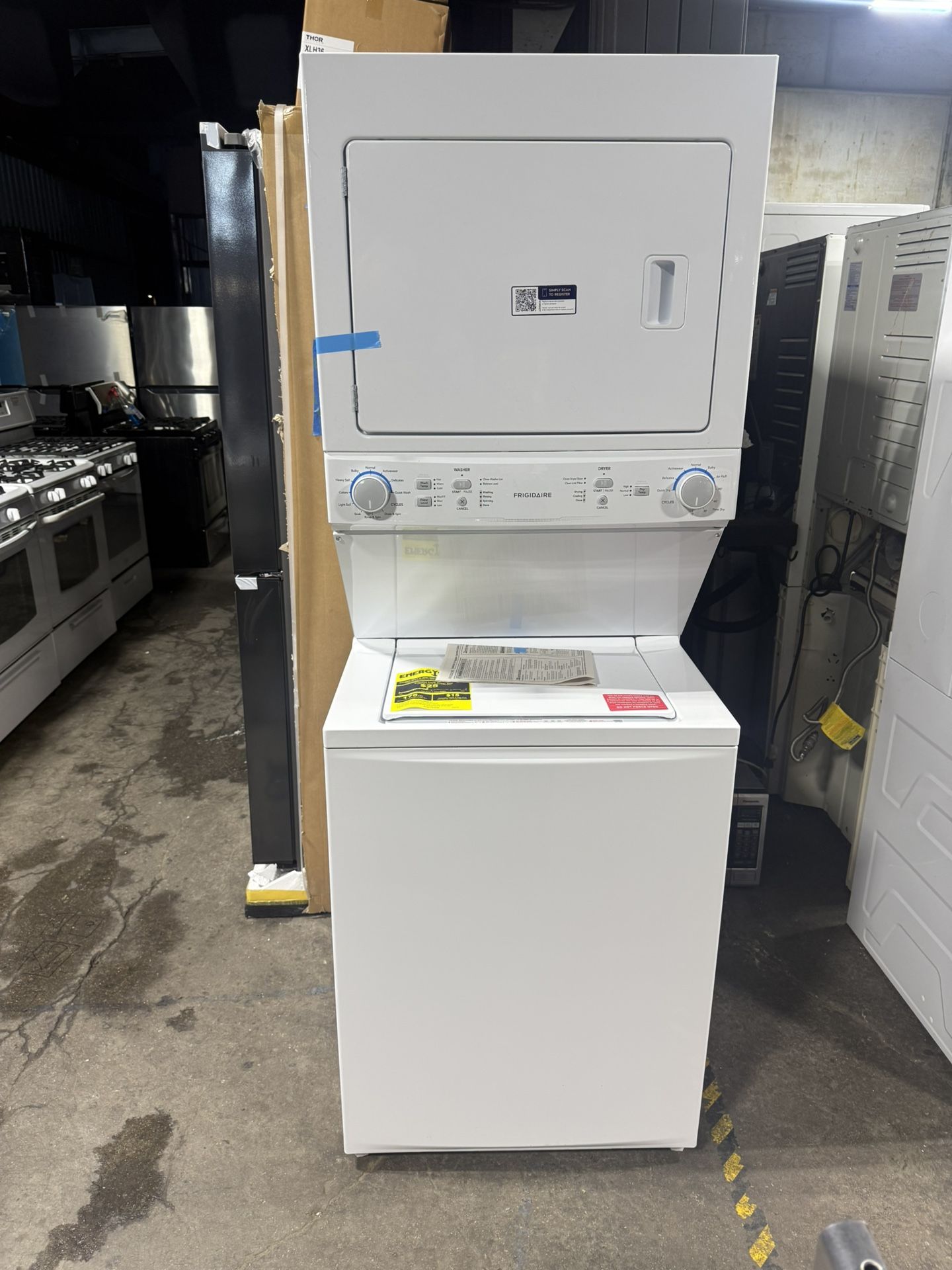 Brand new Frigidaire 3.9 cu. ft. Washer and 5.5 cu. ft. Dryer Electric Long Vent Stacked Laundry Center in White