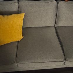 Gray Sofa in Excellent Condition with Yellow Cushions