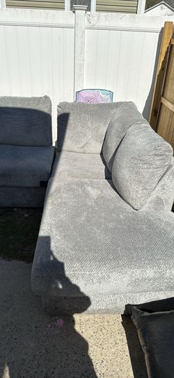 Two piece grey sectional with chase