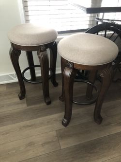 2 BROWN BAR STOOLS