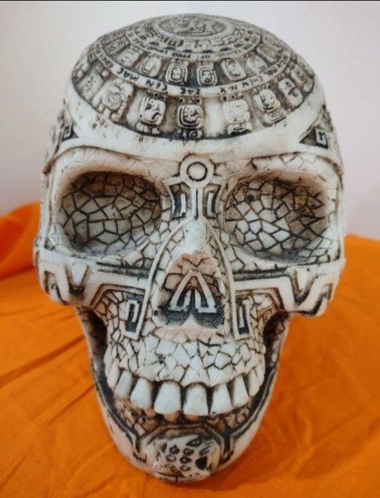 Vintage Reproduction Mesoamerican Maya Aztec Gods Skull Statue with Tribal Tattoo Figurine; Relief carvings around the entire skull.