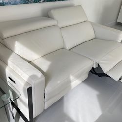 New!!! Power Reclining Loveseat Real Leather, adjustable headrest and footrest. Dimensions 63 W x 33 H x 43.5 L , Was $2,300