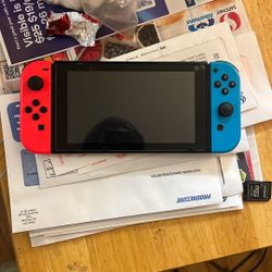 Nintendo Switch Version 2 Like New and Includes Account with Lots of Games to Play
