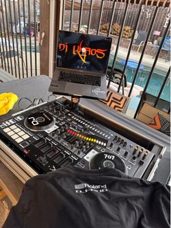Roland Dj 808 controller with case, laptop holder, printed manual and t-shirt with a sticker
