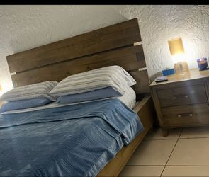 King bed frame and backboard with 2 night stands barely used.