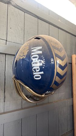 Two Huge Modelo helmets