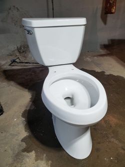 Unused KOHLER toilet W a Service Kit Of New Parts
