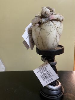Spooky Inspired Polyresin Candlestick ,and bleeding heart candle.