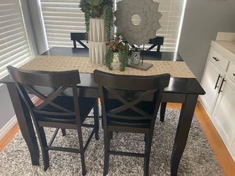 Solid wood black table with four chairs