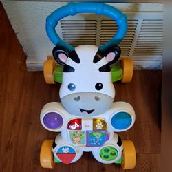 Used Baby walker with music games lights