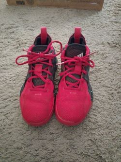Red, back and white Adidas shoes