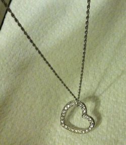 Swarovski Silver Tone Clear Rhinestone Open Heart Side Hanging Pendant Necklace.