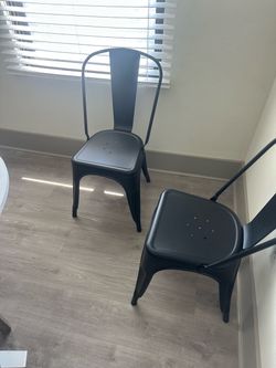 Set of 4 dark gray metal chairs — $100 for all four!