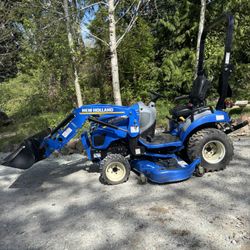 Tractor With Loader, Mower, And Rototiller
