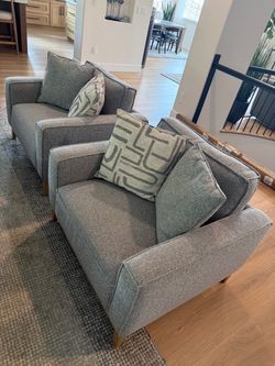 Pair of Gray Accent Chairs with pillows