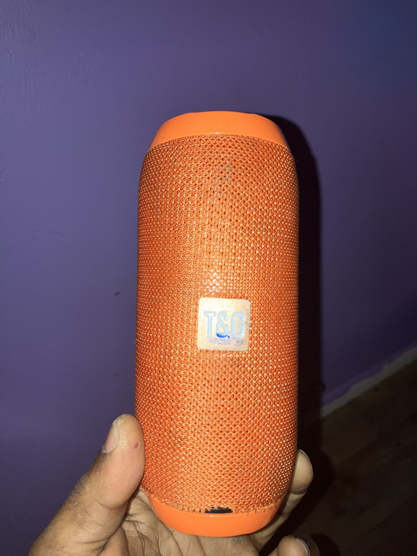 Three Bluetooth speakers one with the LED light and one is a regular speaker like a bullet