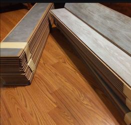 Light gray laminate flooring from 18' x 16' room remodel