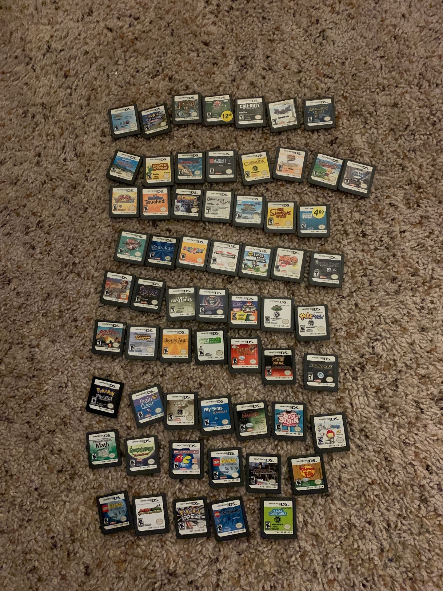 61 ds games and two ds cases + cartridge holder