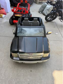 Black Chevrolet Silverado ride-on toy truck 12v