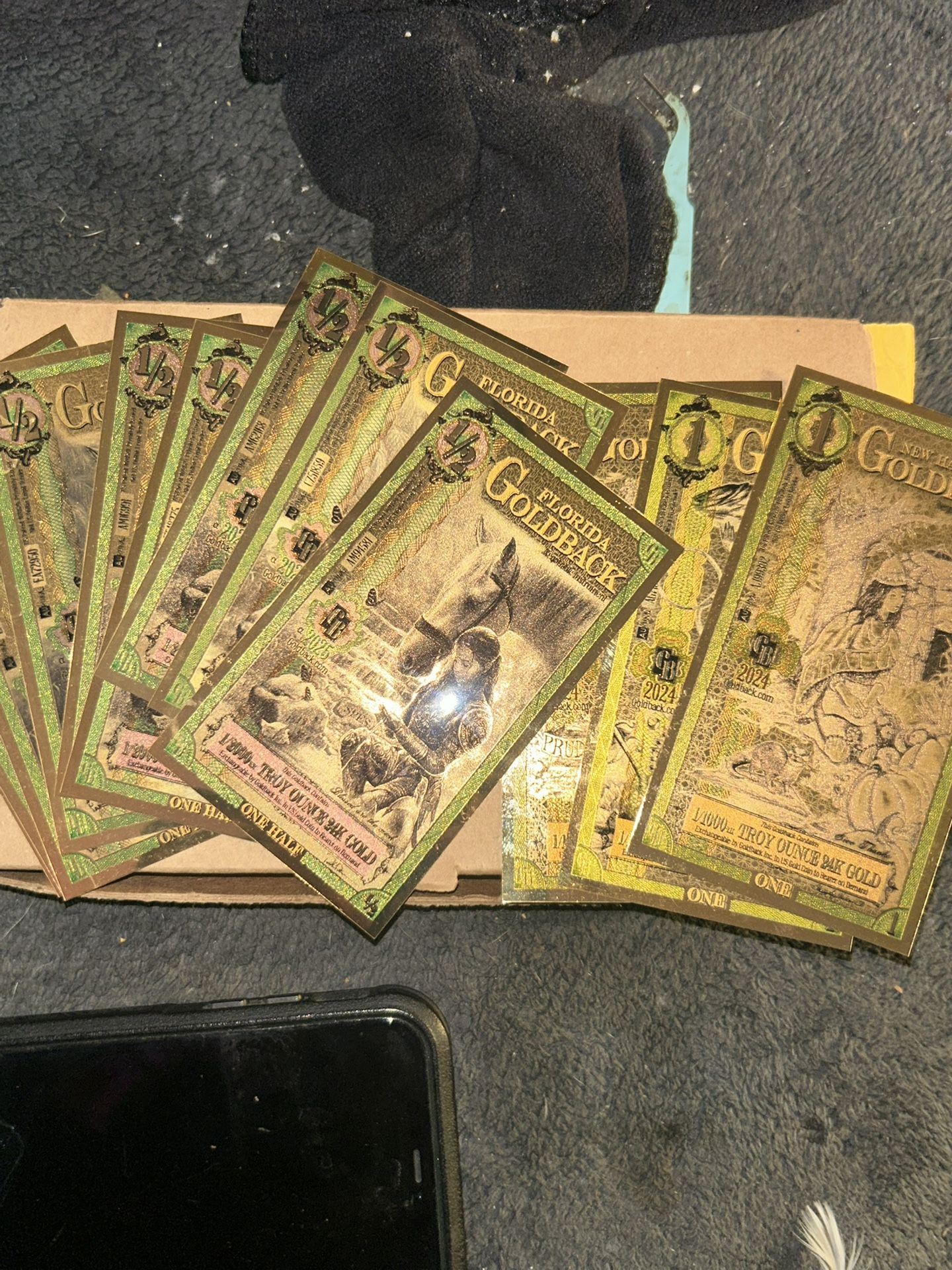 nine Individual Half Gold Back And Three Individual One Dollar Gold Back
