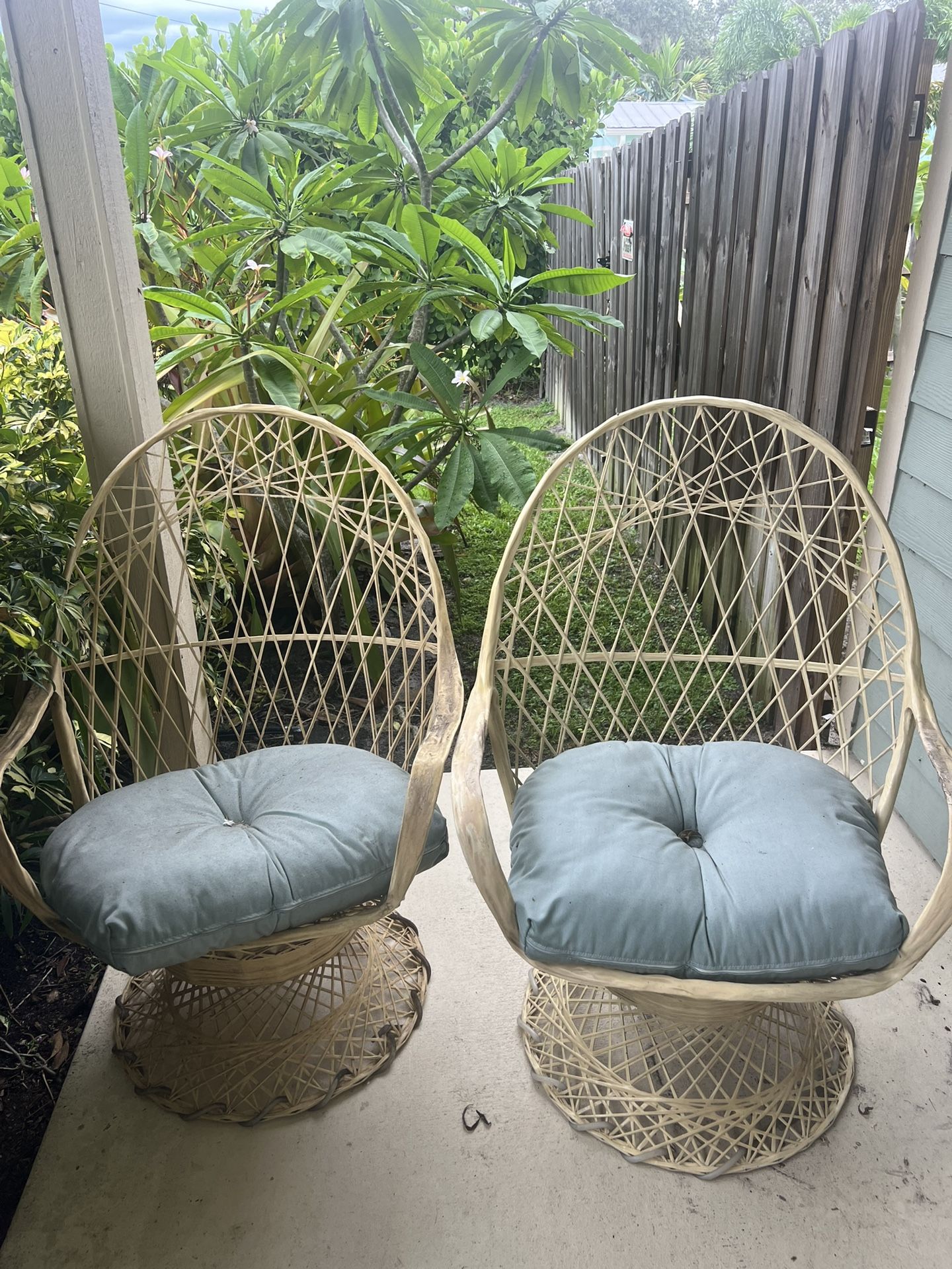 Pair Russell Woodard Spun Fiberglass Mid Century wicker swivel chairs peacock type high back