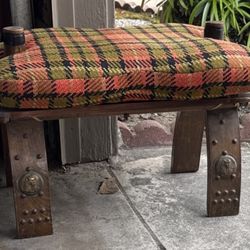 Vintage antique stool a traditional Egyptian camel saddle stool.