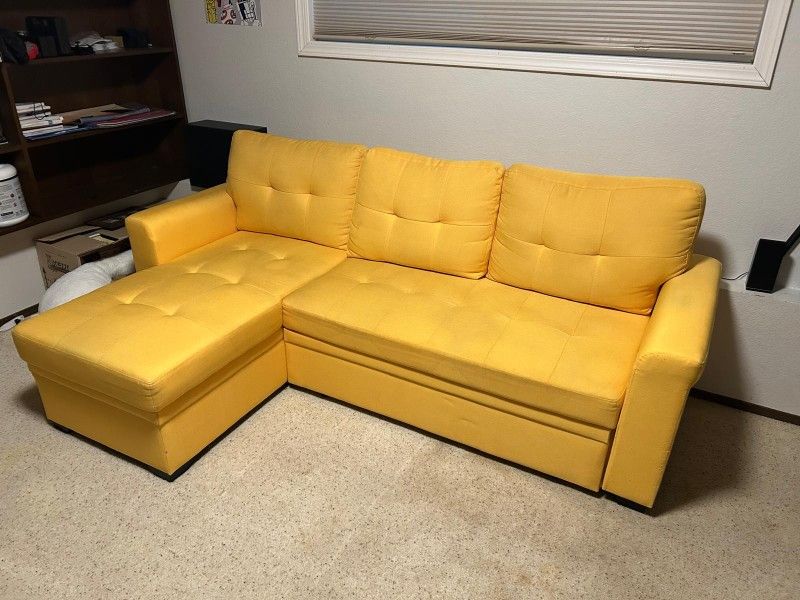 Yellow couch with reversible chase convertible to bed