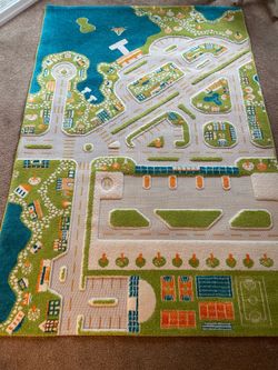 Kids play carpet, raised design of city