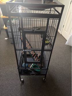 Tall metal birdcage Includes extras