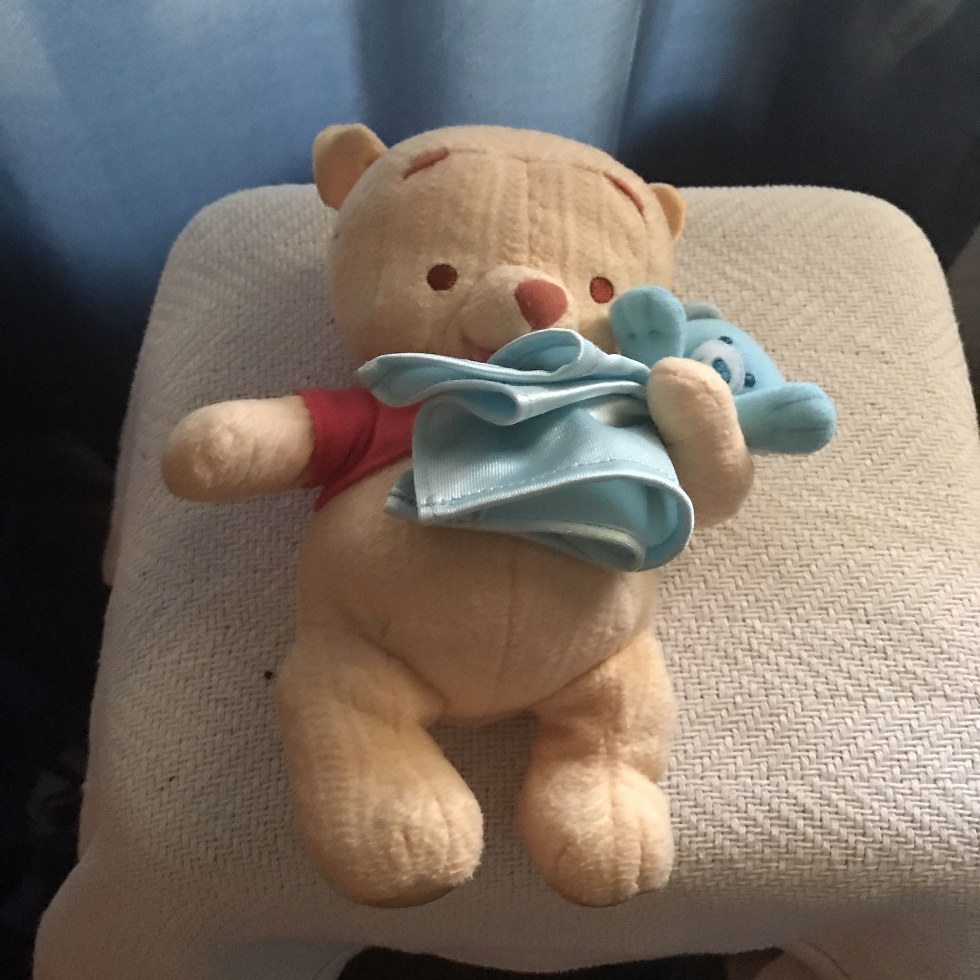 Winnie The Pooh Holding Blue Teddy Bear 